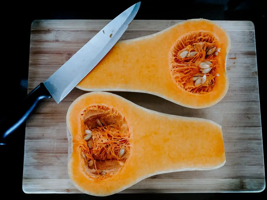A whole squash sliced into two