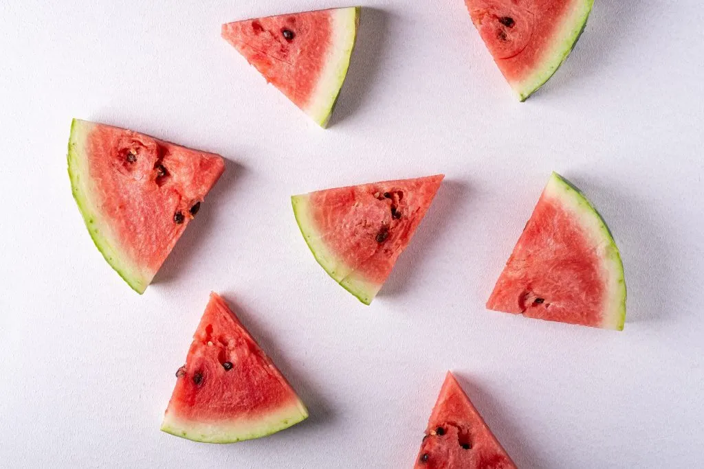 A picture of a watermelon cut into tiny pieces 